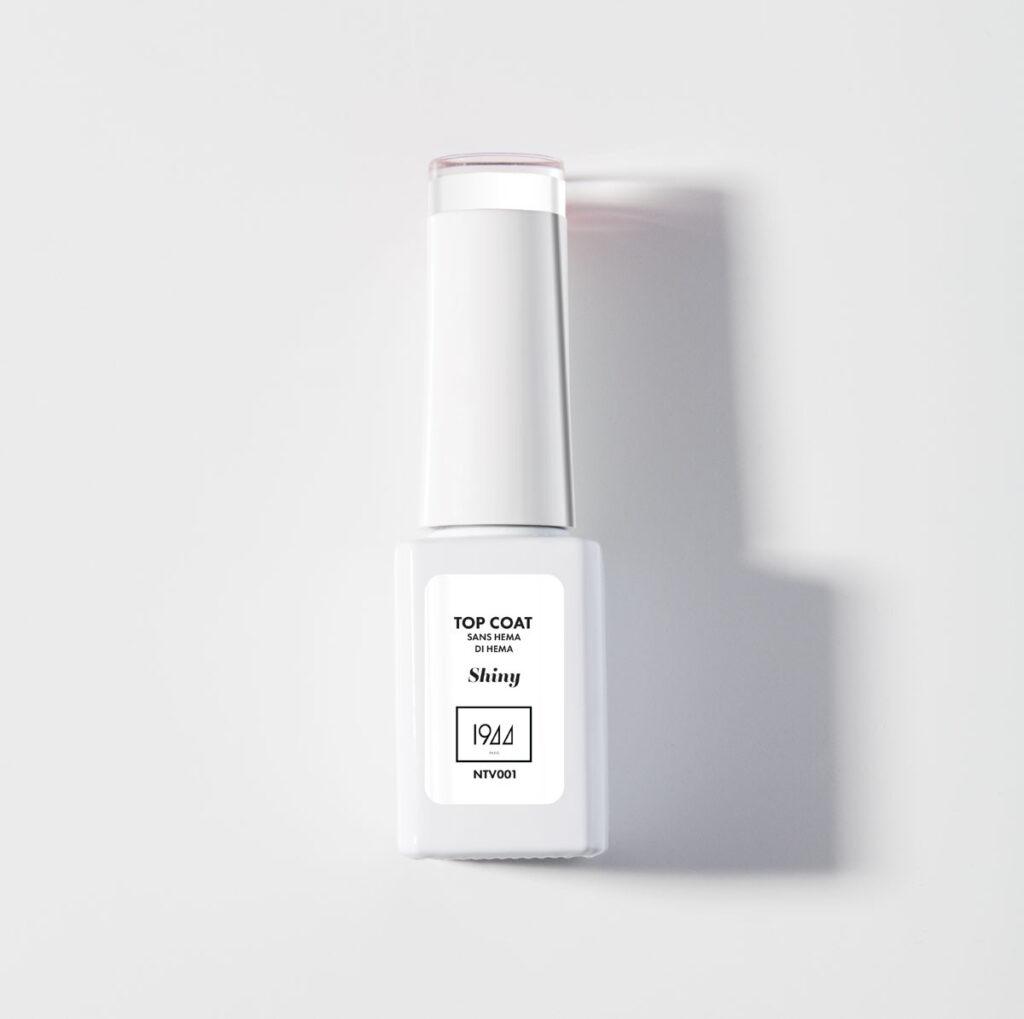White nail polish bottle with a shiny finish, labeled 'Top Coat' and 'Shiny' on a white background