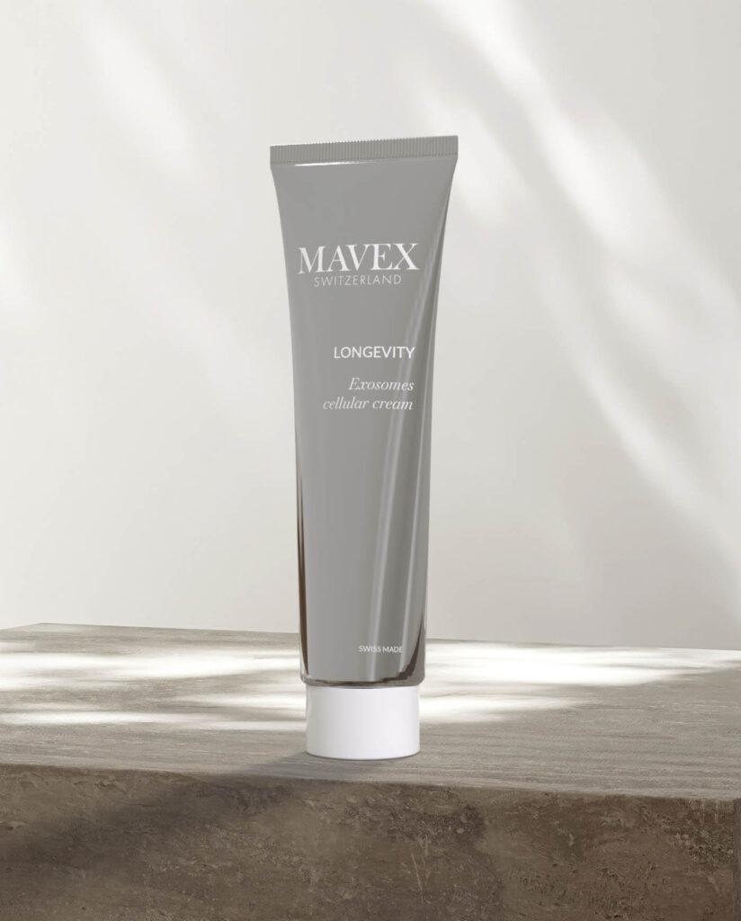 Gray tube labeled MAVEX Longevity Exosomes cellular cream standing on a wooden surface.