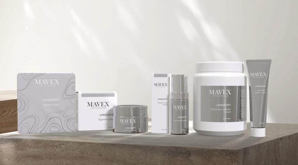 MAVEX Longevity skincare set displayed on a wooden counter with gray-silver packaging and tubes/bottles.