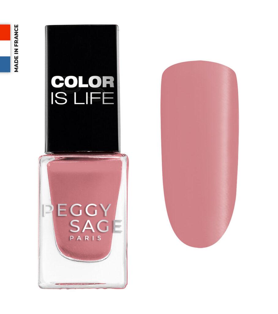 Pink nail polish bottle with black cap reading 'COLOR IS LIFE' and a pink swatch to the right on a white background, Made in France label visible on the cap.
