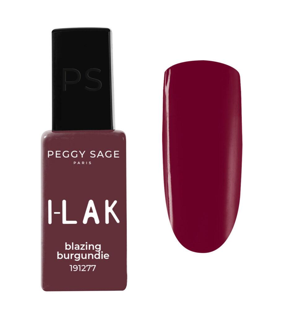 Peggy Sage I-LAK nail polish in blazing burgundie (191277) with a matching burgundy swatch beside the bottle.
