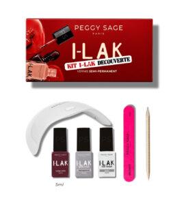 Peggy Sage I-LAK gel nail kit displayed with red box, three polish bottles, a white UV/LED lamp, pink nail file, and wooden cuticle stick on white background.